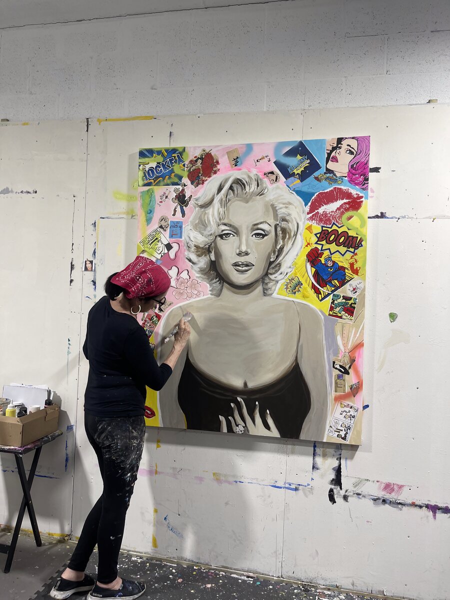 Maureen Fulgenzi painting a pop-art portrait in her studio