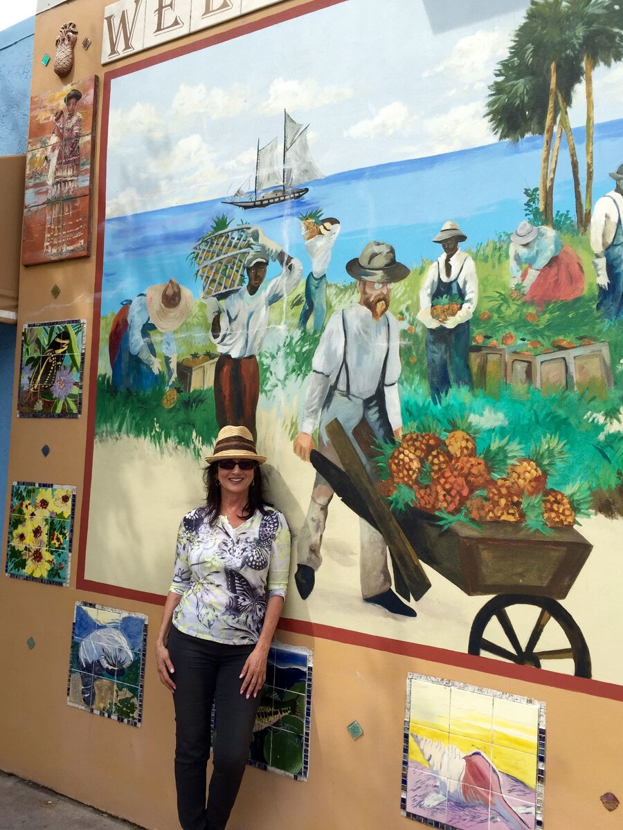 Maureen Fulgenzi in front of the finished Downtown Stuart mural