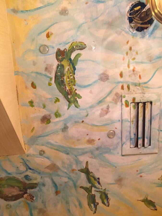 Turtle and tropical fish mural detail near a light switch, Palm Beach, FL