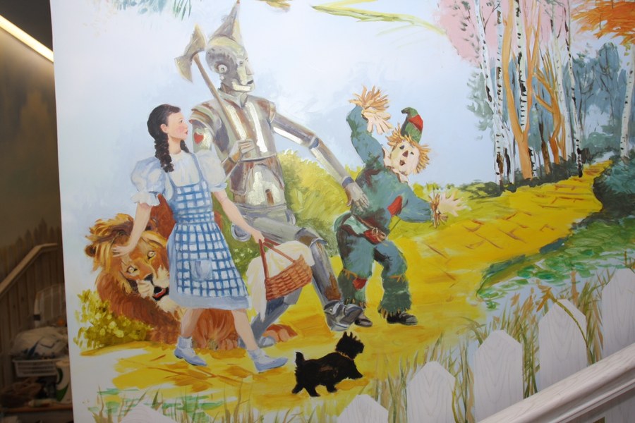 Wizard of Oz yellow brick road mural detail above a staircase, Palm Beach, FL