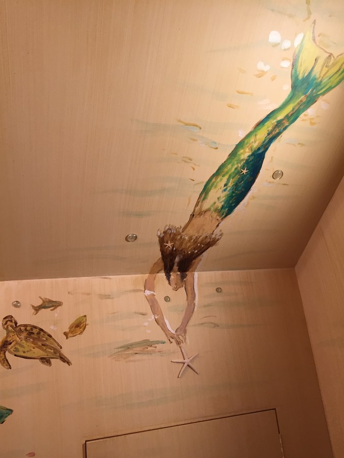 Mermaid mural painted into a powder room corner with turtle detail, Palm Beach, FL
