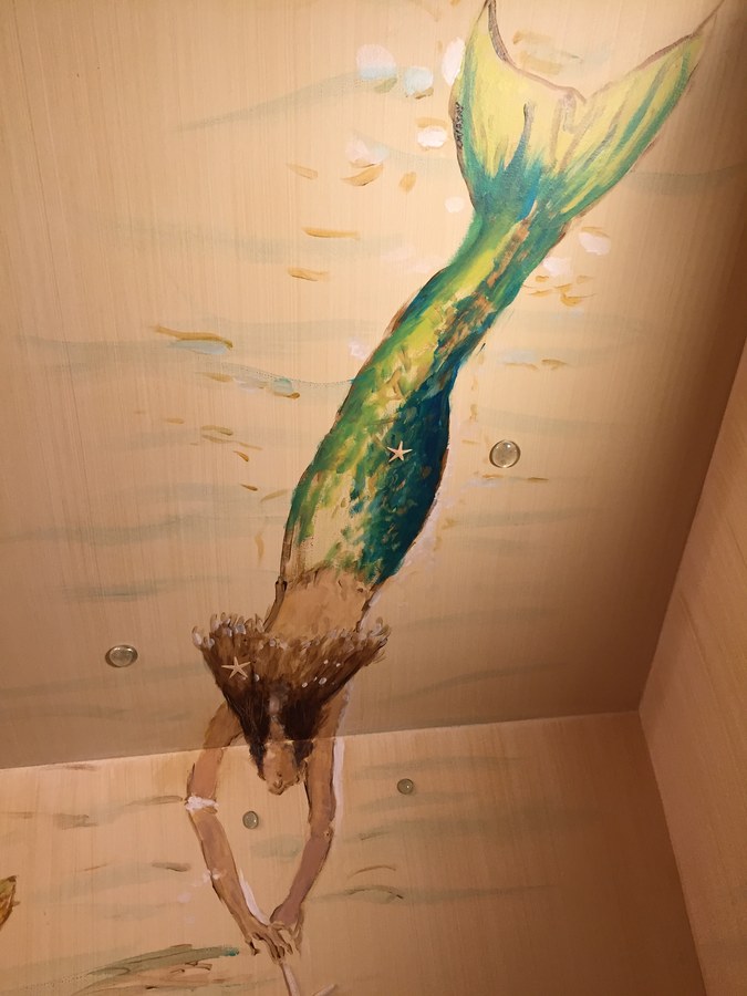 Green-tailed mermaid mural detail on the wall, Palm Beach, FL