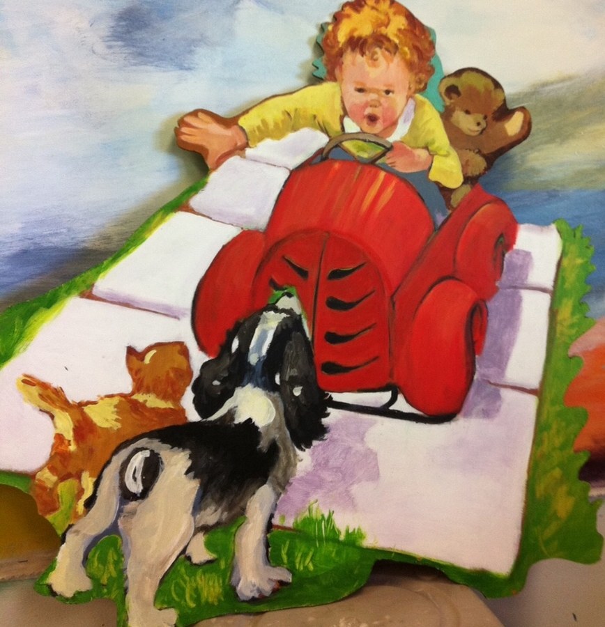 Painted cutout of a boy on a tricycle mounted on a sky-painted backdrop by Maureen Fulgenzi, Palm Beach, FL