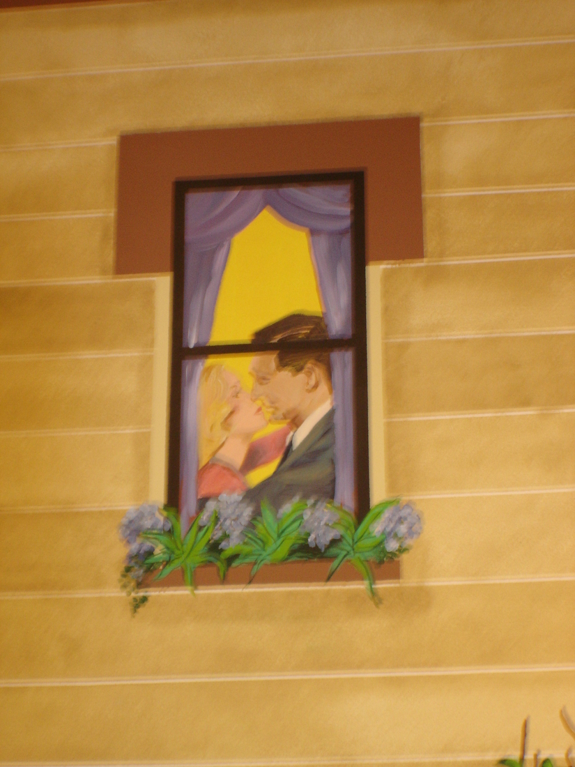 Close-up of a painted window mural with a romantic couple and flower box, car museum backdrop, Palm Beach, FL