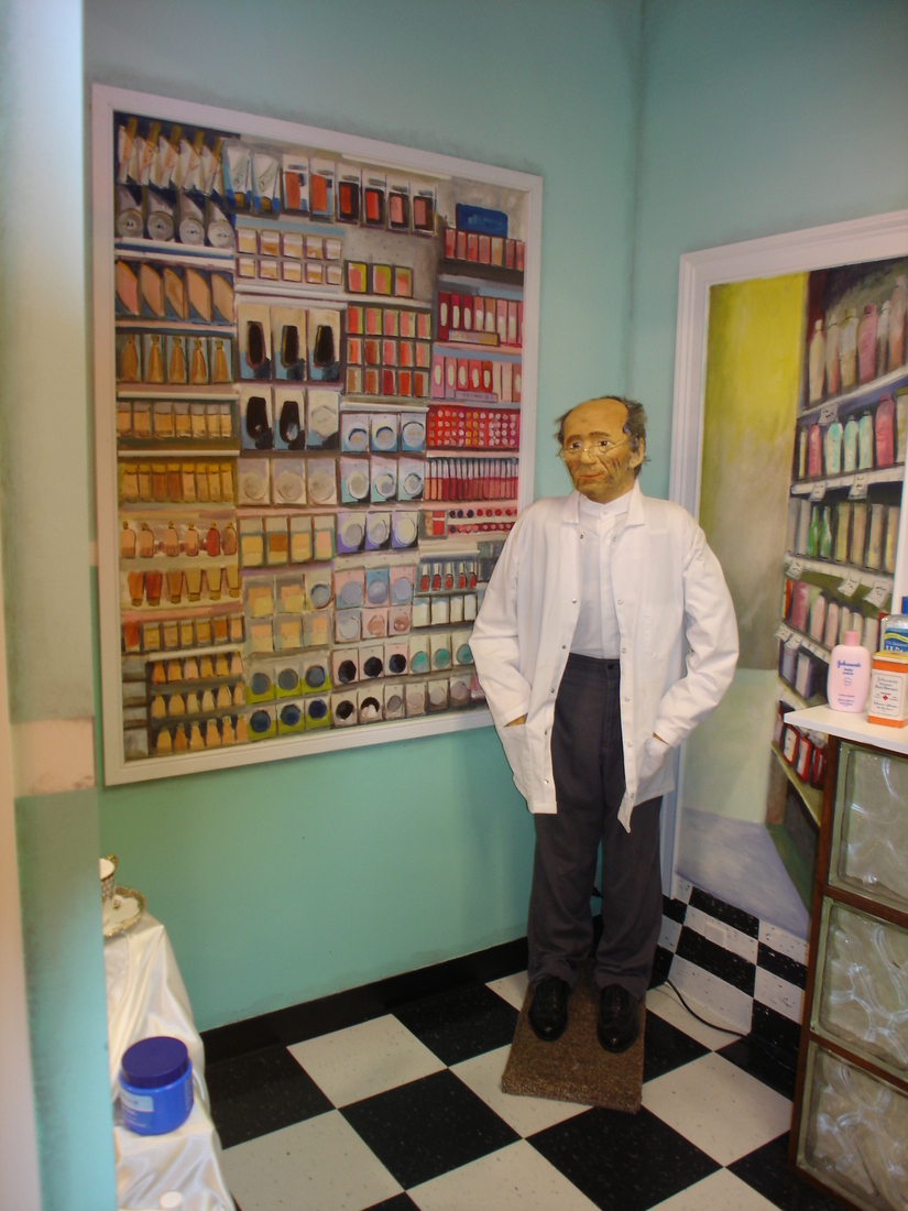 Pharmacy interior mural with a painted pharmacist figure among shelving, car museum backdrop, Palm Beach, FL
