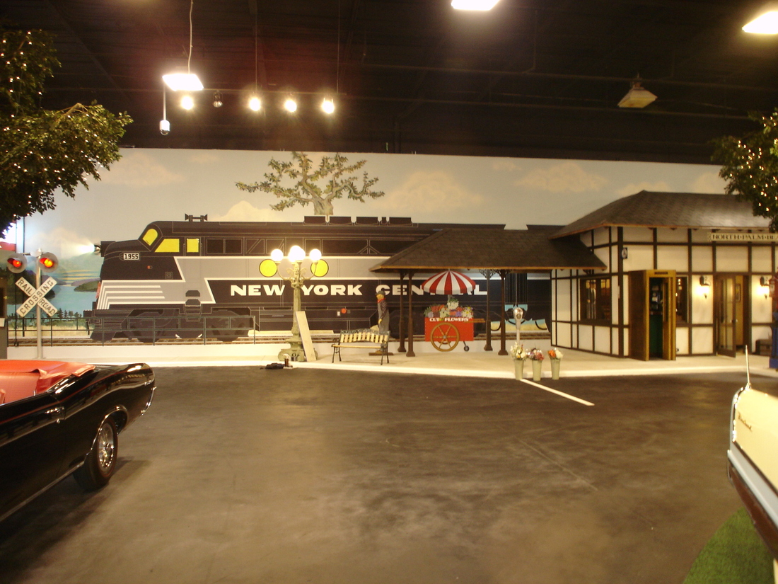 Painted vintage diner exterior and roadway mural backdrop, car museum, Palm Beach, FL