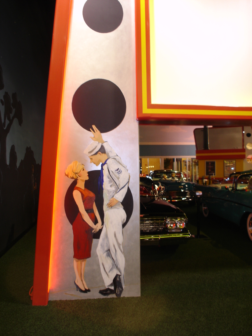 Art deco theater marquee mural with painted couple figures, car museum backdrop, Palm Beach, FL