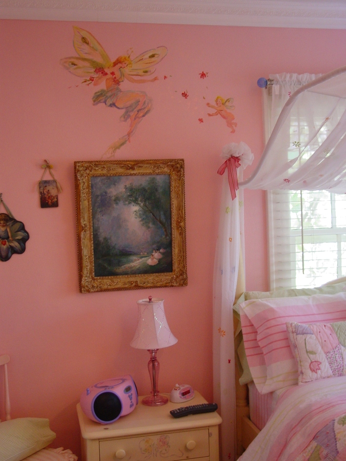 Wide room view of the pink fairy mural above a painted bed frame and window, Palm Beach, FL