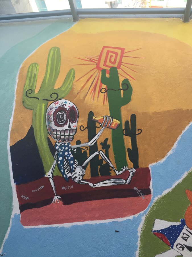 Day of the Dead skeleton figure with cactus and sunburst, exterior terrace mural, Palm Beach, FL