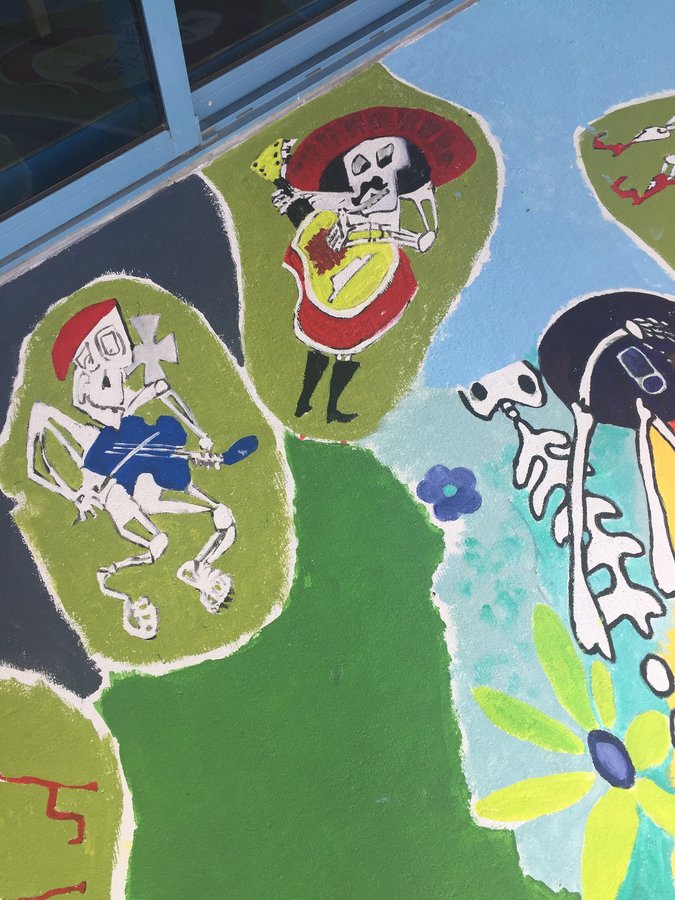 Wide view of the running and mariachi skeleton vignettes together, exterior terrace mural, Palm Beach, FL