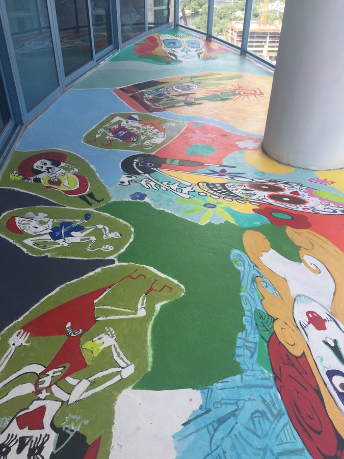 Wide view of the full terrace wall showing several Day of the Dead vignettes in sequence, Palm Beach, FL