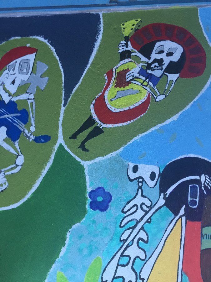 Wide view of the mariachi and toasting skeleton vignettes together, exterior terrace mural, Palm Beach, FL
