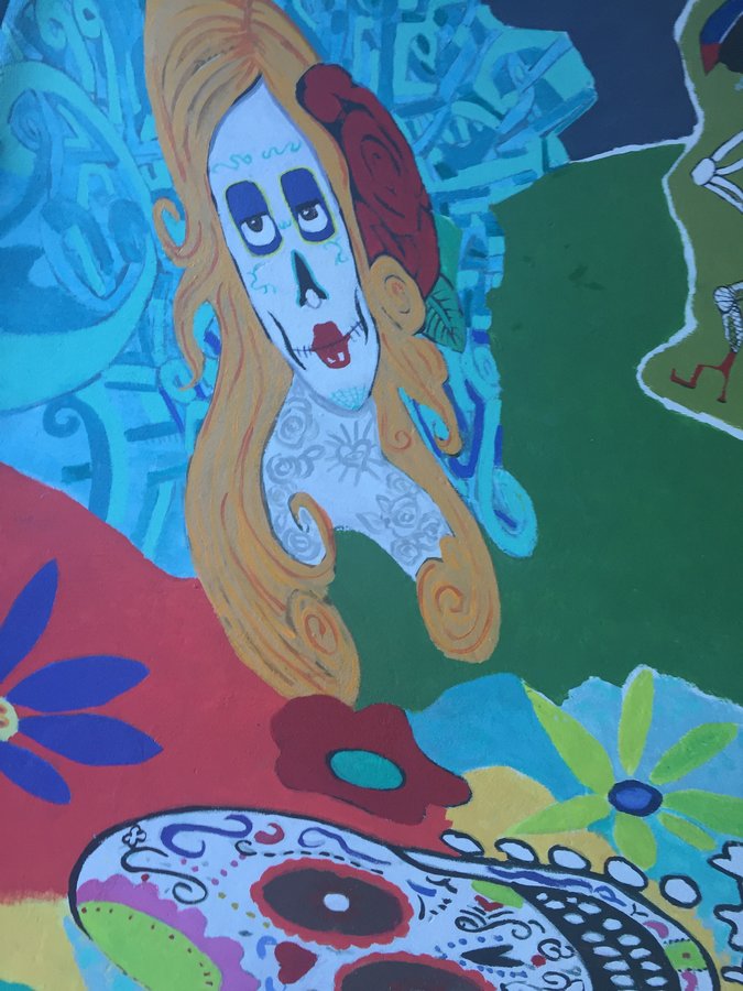 Painted sugar-skull-faced woman with a rose, closer crop, exterior terrace mural, Palm Beach, FL
