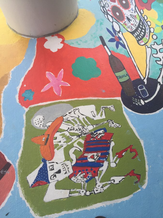 Skeleton figures dancing in a red serape, small vignette on the exterior terrace mural, Palm Beach, FL