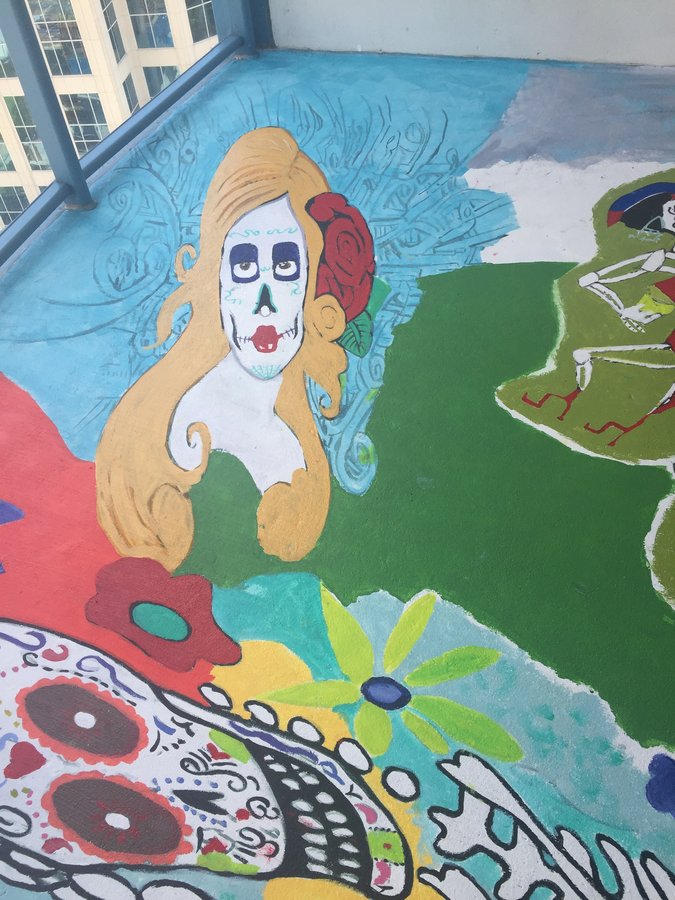 Painted sugar-skull-faced woman with a rose, exterior terrace mural, Palm Beach, FL