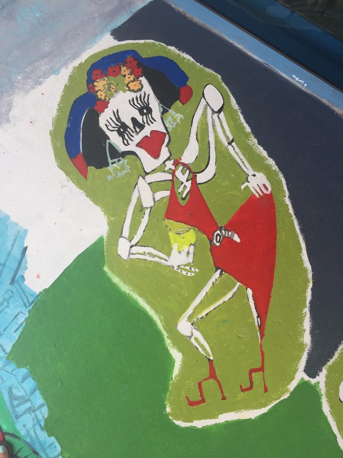 Closer view of the dancing skeleton couple in red, exterior terrace mural, Palm Beach, FL