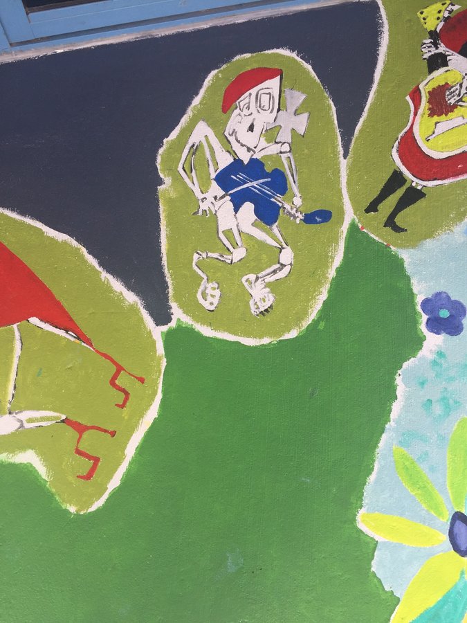 Skeleton figure in blue shorts running, small vignette on the exterior terrace mural, Palm Beach, FL