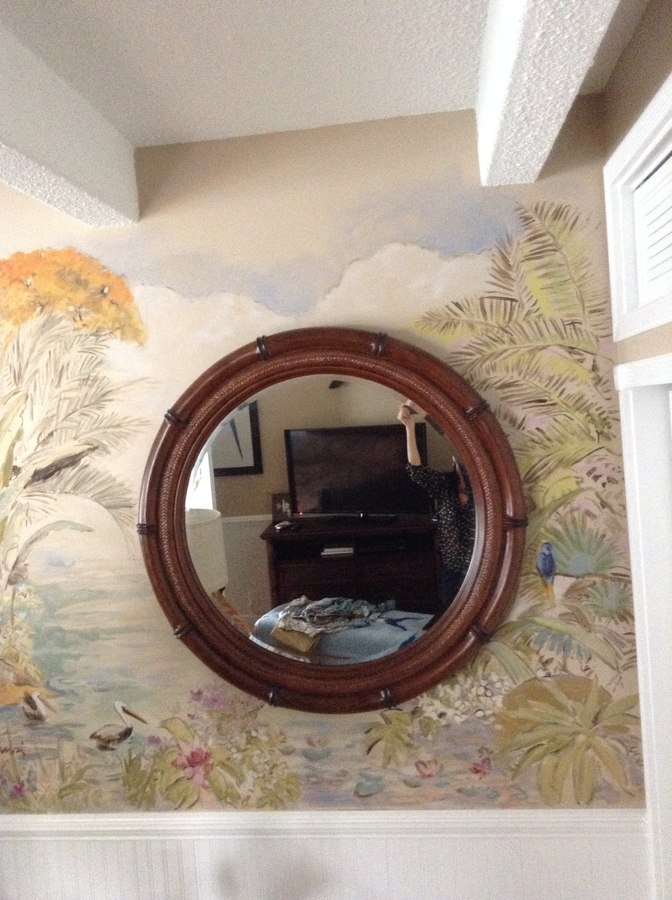 Sailboats and harbor mural detail framing the round mirror, Palm Beach, FL