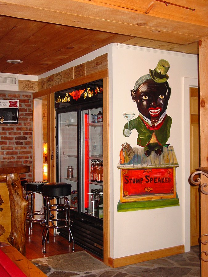 Stump Speaker toy figure mural beside a wine-crate bar and beverage fridge, Palm Beach, FL