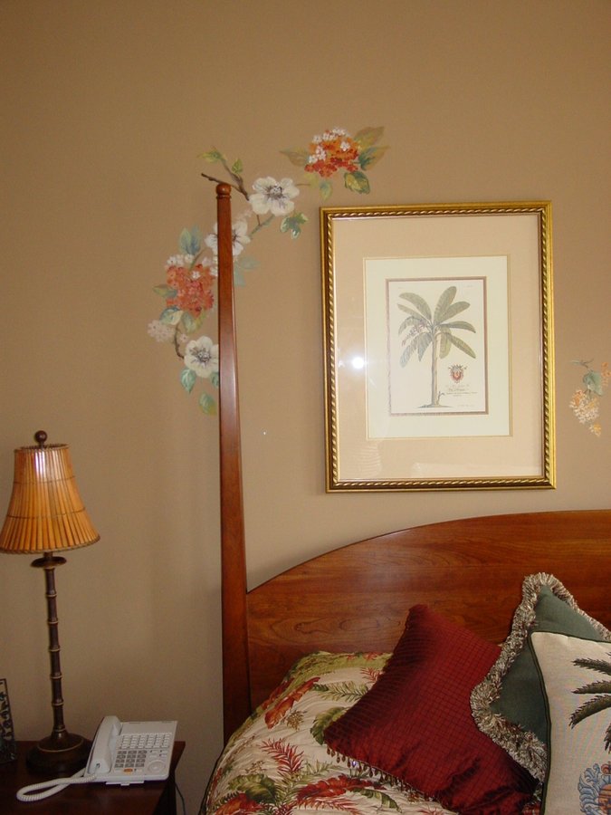 Wide bedroom view of the floral branch mural above a four-poster bed, Palm Beach, FL
