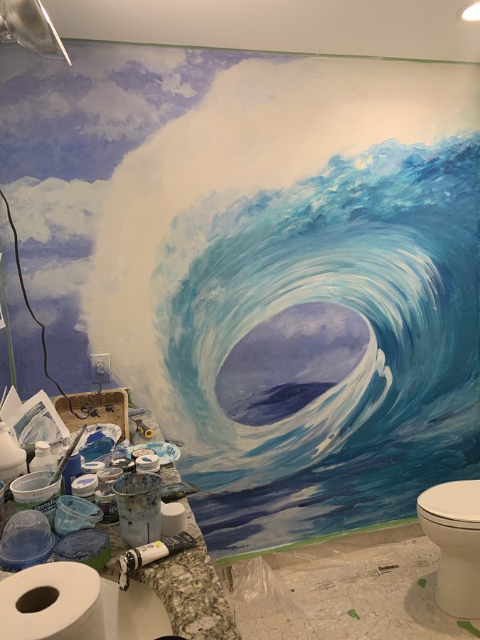 Ocean wave mural in progress with paint supplies on the vanity counter, Palm Beach, FL