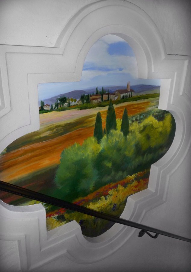 Tuscan field mural detail with a stone tower and cypress trees, Palm Beach, FL