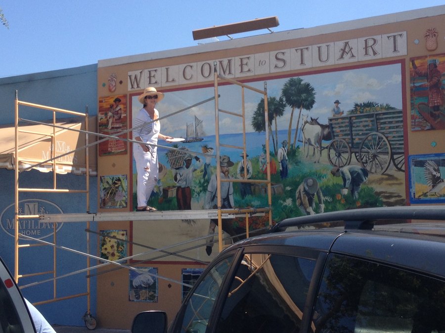 Wide scaffolding view of the Stuart mural in progress with shade tarp, Palm Beach, FL