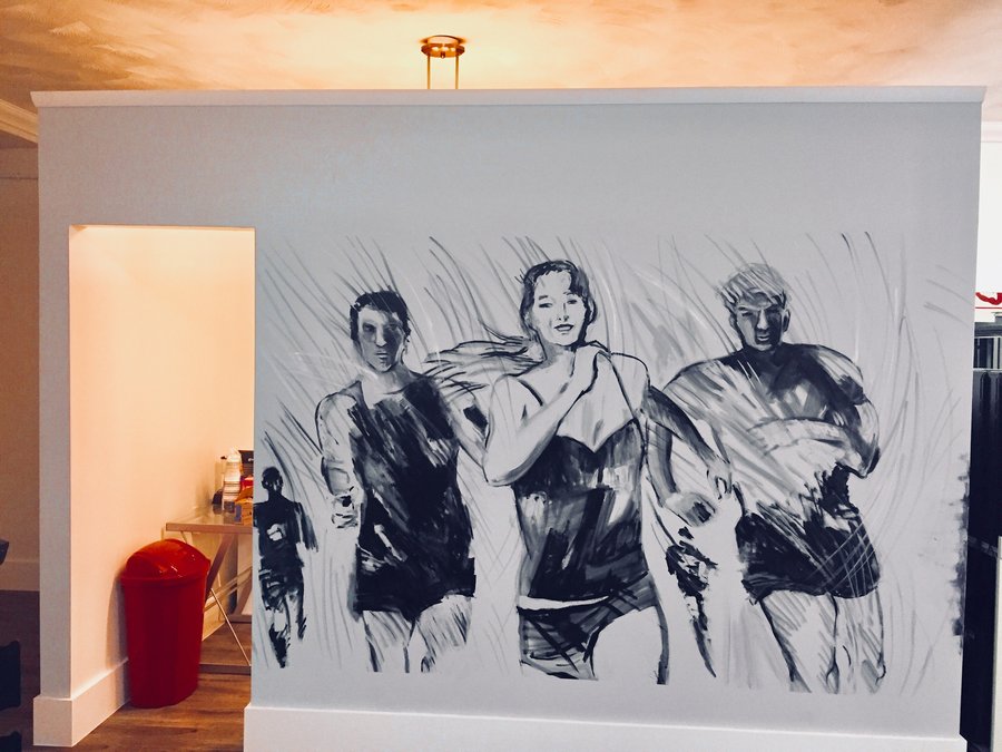 Three-runner ink sketch mounted in the gym entryway, black and white with red accent, Palm Beach, FL