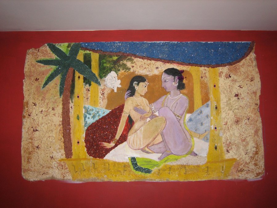 Third view of the two-dancer wall panel under the palm-thatched roof, Ada Indian Restaurant, Palm Beach, FL