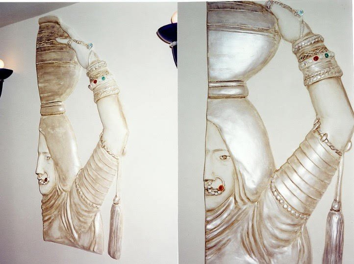 Sculpted plaster relief of a dancer's bangled arms, wall panel at Ada Indian Restaurant, Palm Beach, FL