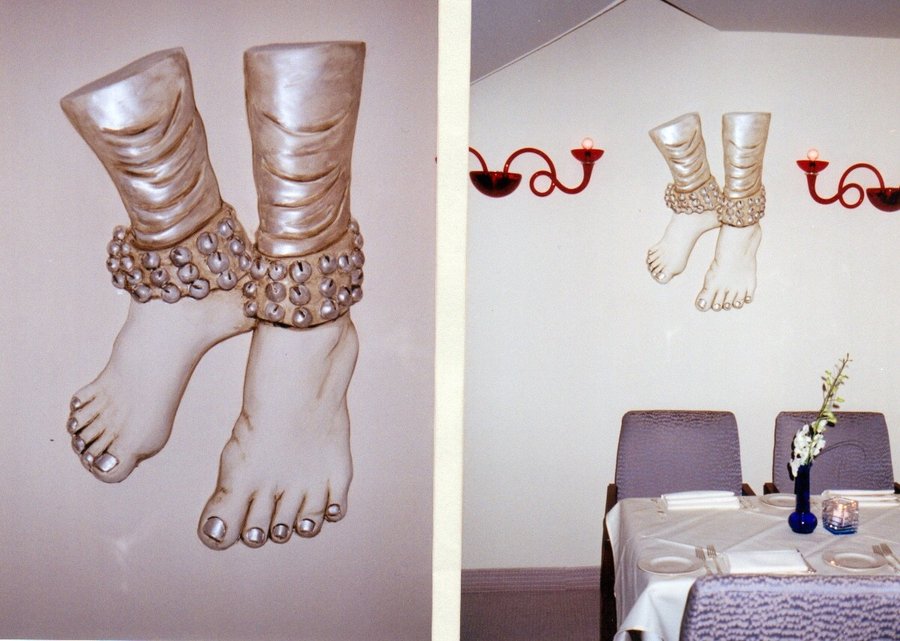 Sculpted plaster relief of dancers' feet and ankle bangles, wall panel at Ada Indian Restaurant, Palm Beach, FL