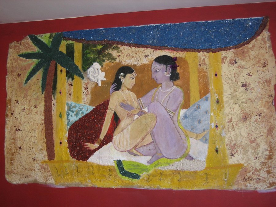 Second view of the two-dancer wall panel under the palm-thatched roof, Ada Indian Restaurant, Palm Beach, FL