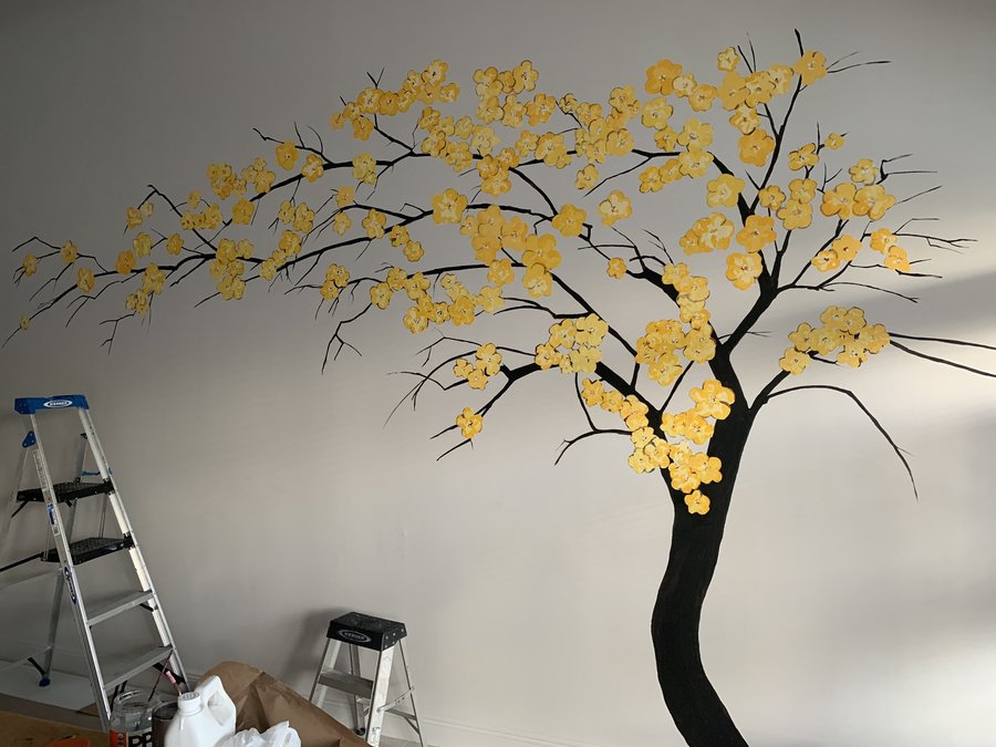 Cherry blossom tree mural mid-progress with a ladder in the room, Pho and Rolls, Palm Beach, FL