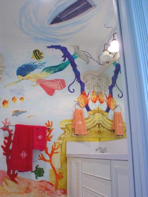 Mermaid mural wide view above a bathroom vanity mirror, Palm Beach, FL