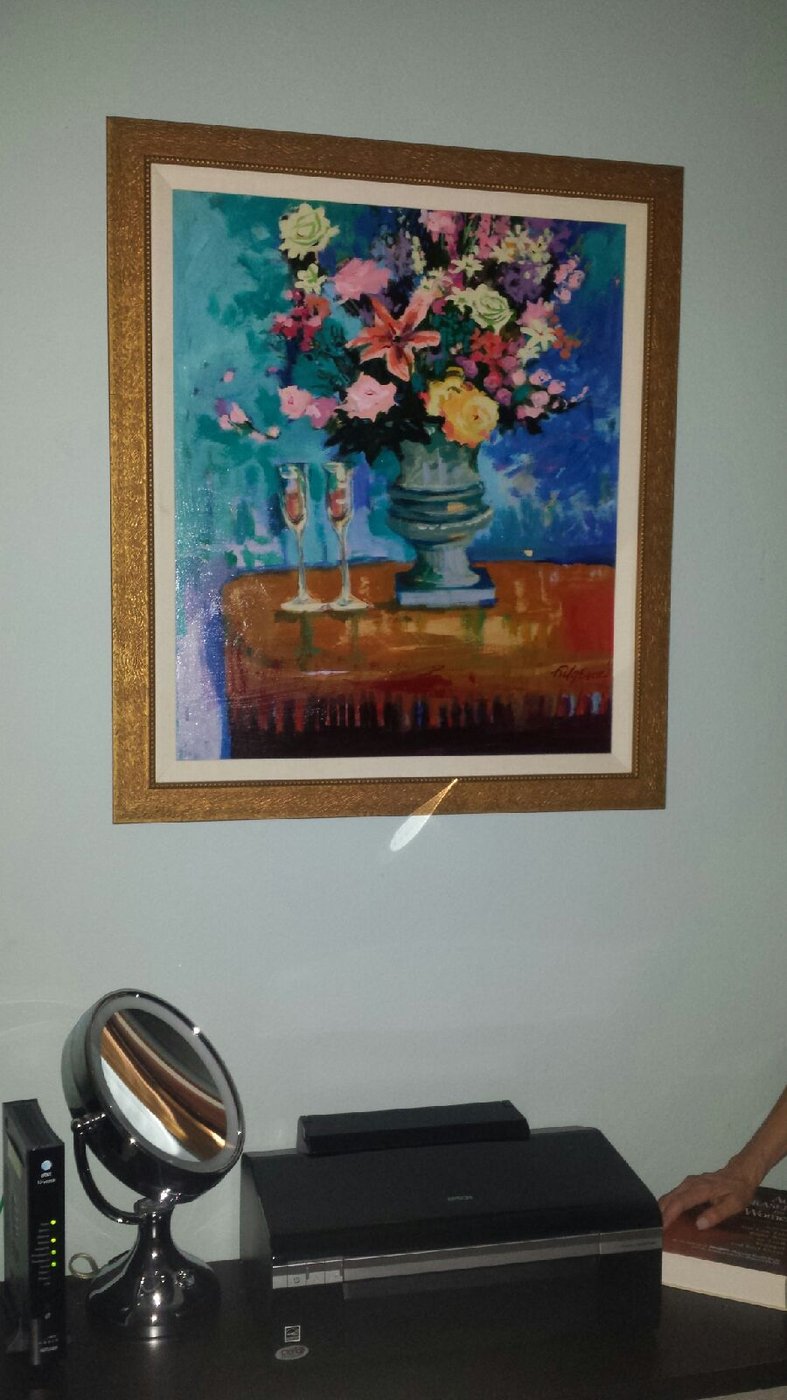 Realistic floral still-life painting by Maureen Fulgenzi in a wood frame above a bedroom vanity, Palm Beach, FL