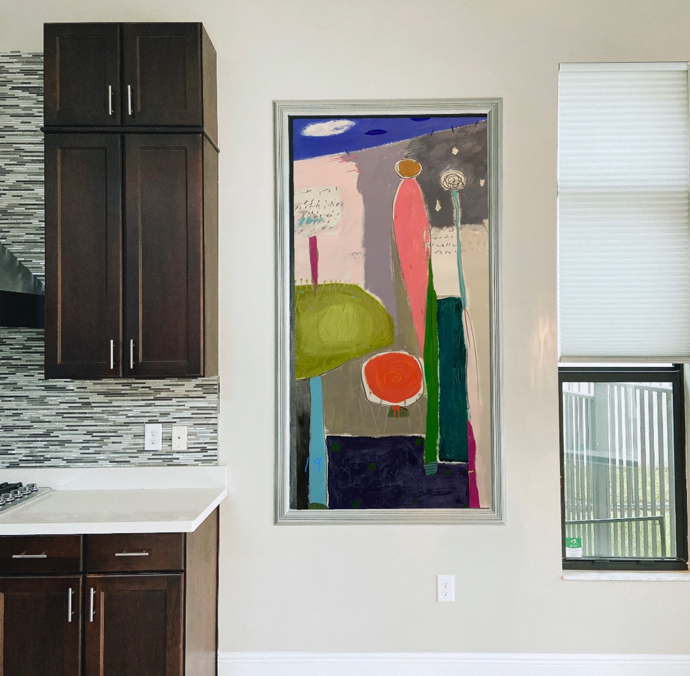 Abstract figures painting by Maureen Fulgenzi above dark cabinetry in a tiled kitchen, Palm Beach, FL